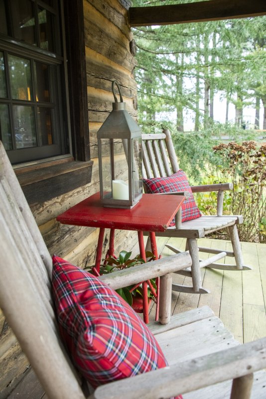 The front porch of the log cabin transported from the Shenandoah Valley to the Willow Creek Road property of Erik Hein and Matt Rogers.